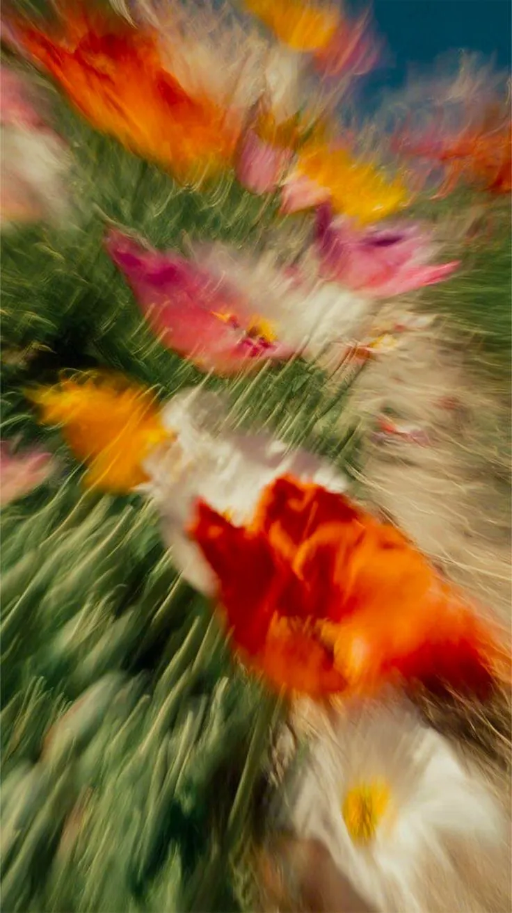 poppies and wildflowers in a rush of motion blur